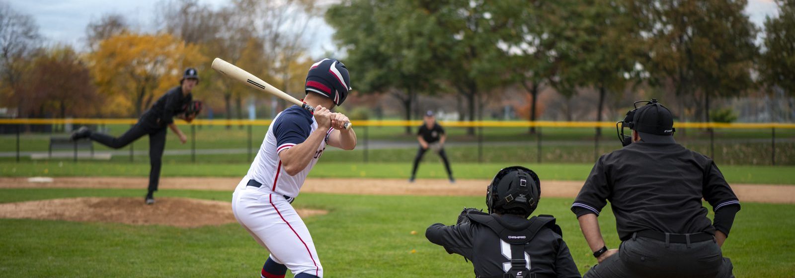 Champro baseball uniforms on the field: BS50 jersey, BP70 pant, AS3 socks and an HXM batting helmet. Manufacturer photography.