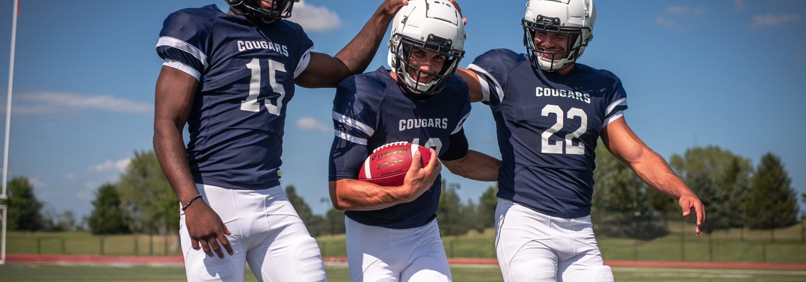 Champro football uniforms on the field: FJ33 jersey and FP33 pant. Manufacturer photography.